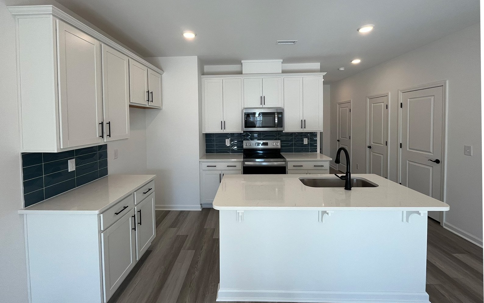 The kitchen in the Lennox on homesite 2554 by Brookfield Residential at Wendell Falls.