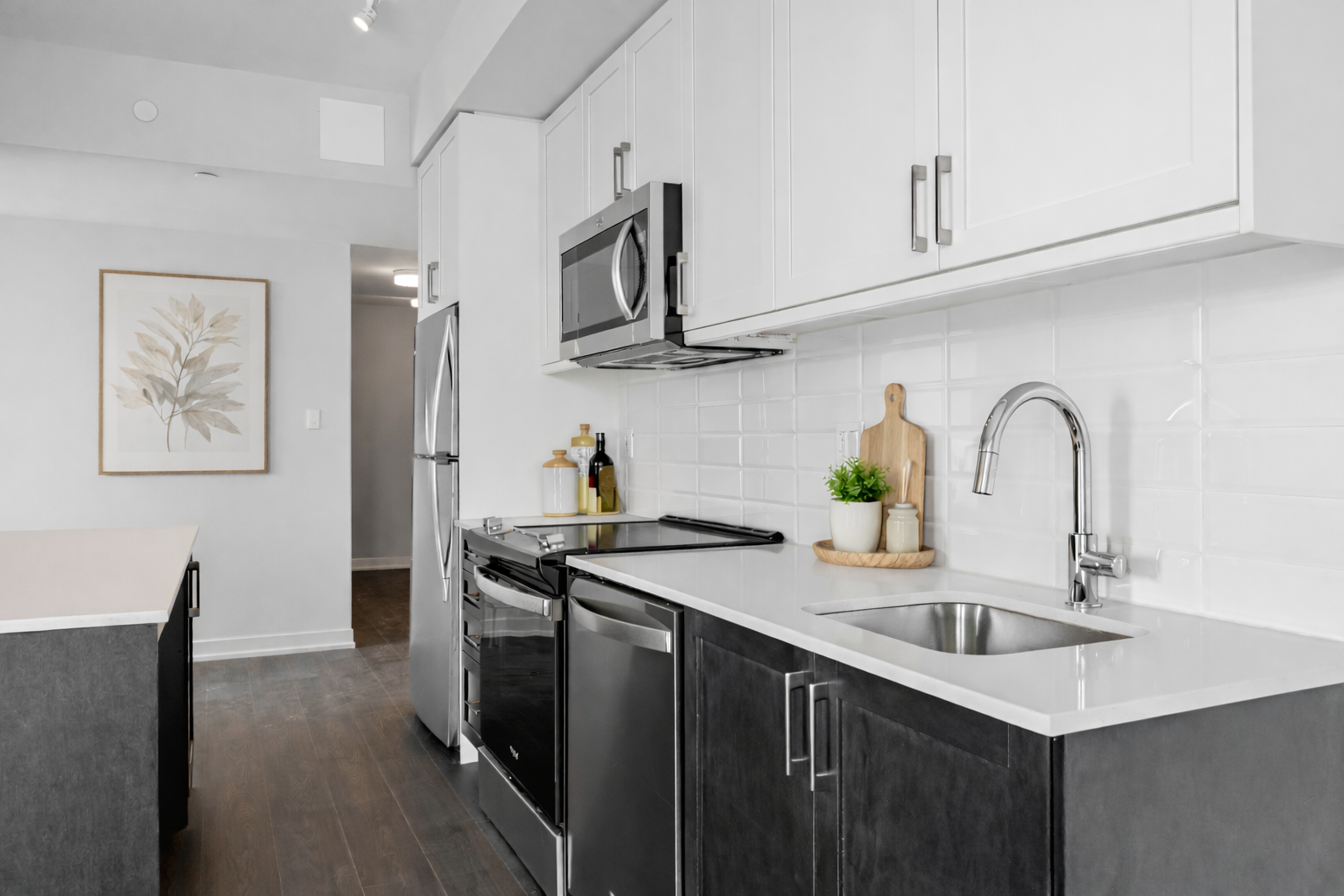 Virtually staged photo of the kitchen in a Trent suite at Station No. 3 in Whitby, ON