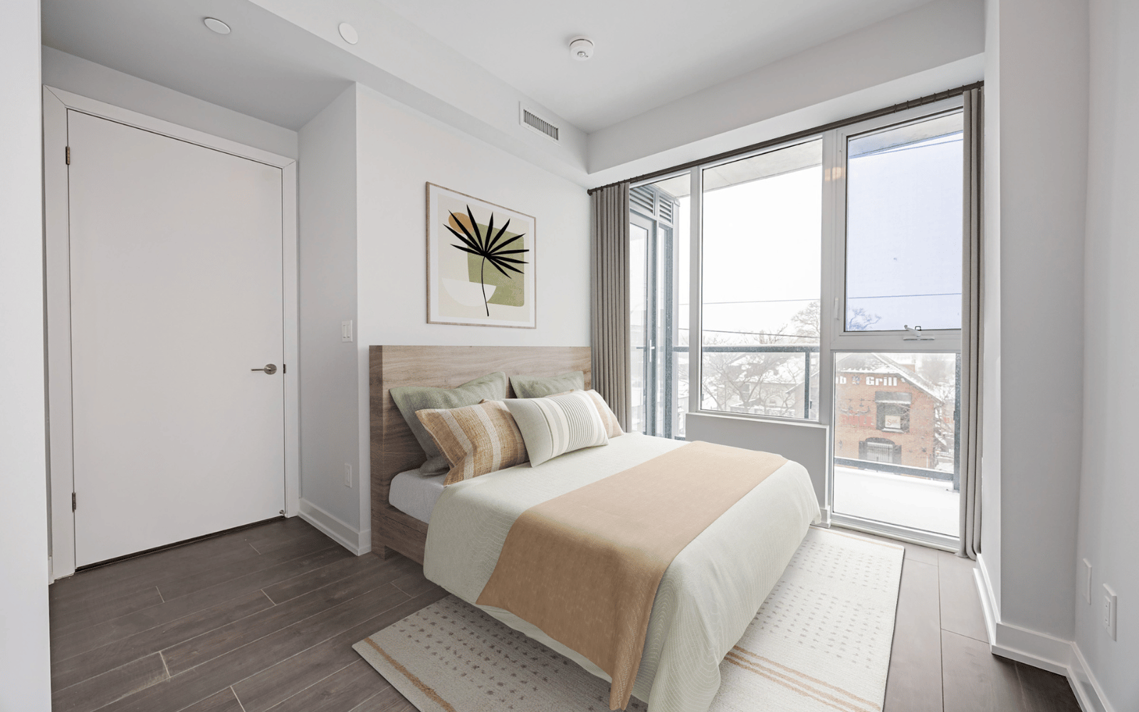 Virtually staged photo of the bedroom in a Trent suite at Station No. 3 in Whitby, ON