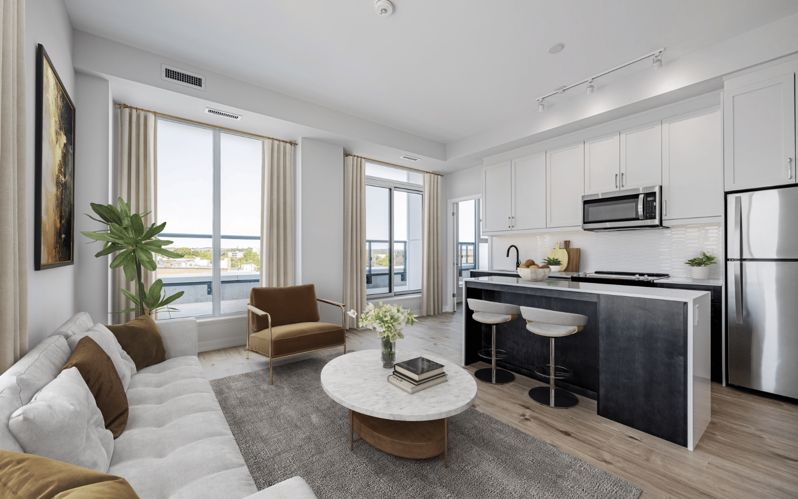 Virtually staged photo of the kitchen and living area in a Wentworth suite at Station No. 3 in Whitby, ON
