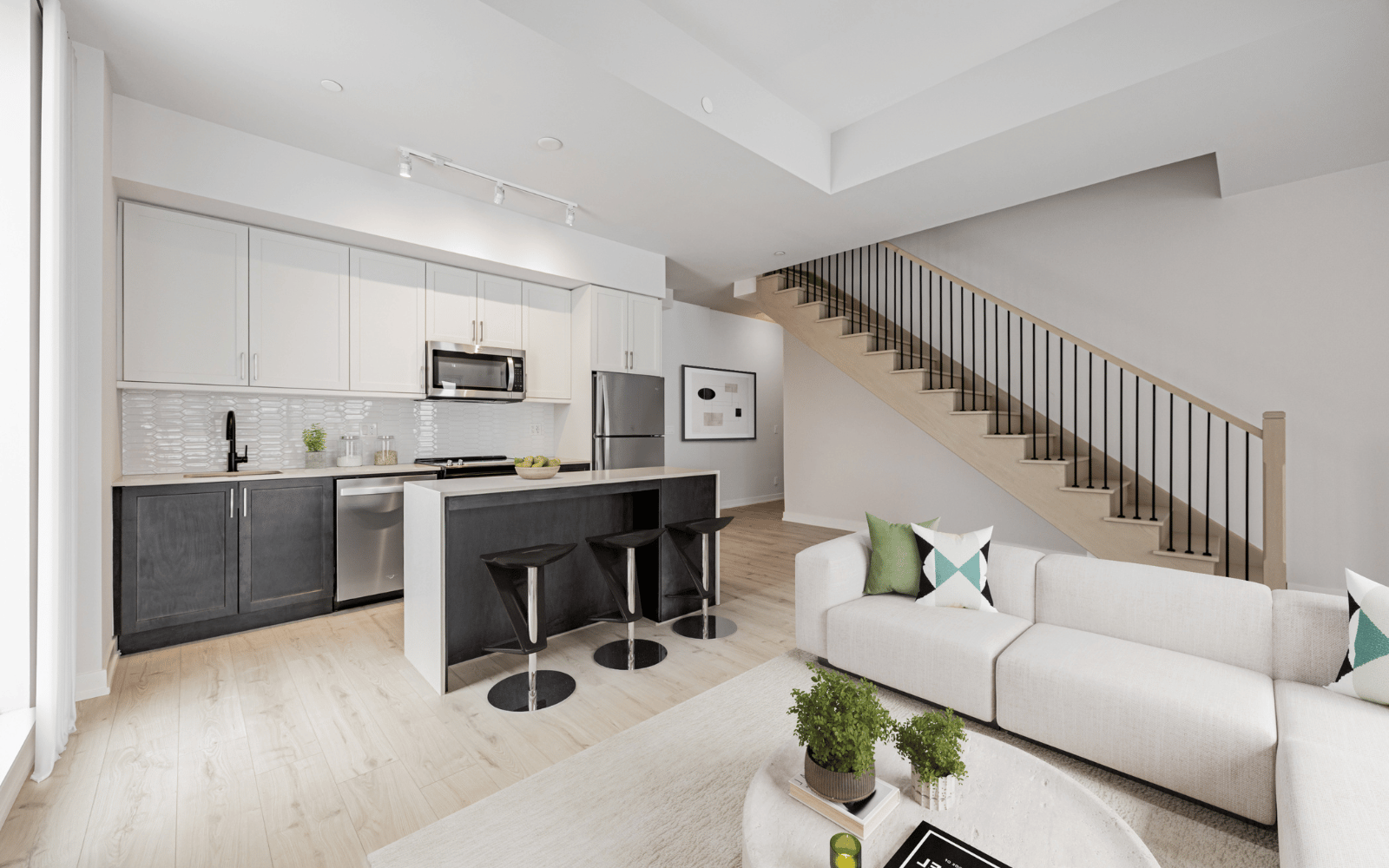 Virtually staged photo of the Kitchen and Living Area in the McQuay design at Station No. 3 in Whitby, ON