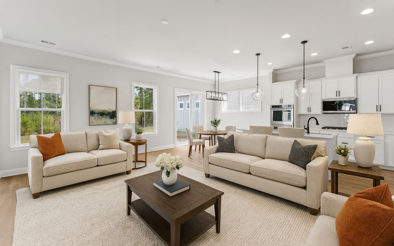 The family room and dining area in the Preston single family home by Brookfield Residential at Nexton.