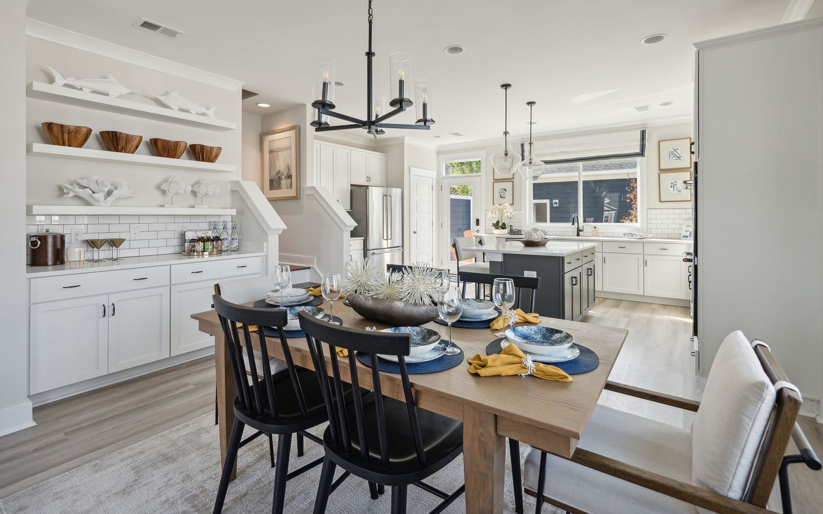 The dining room and kitchen area in the Sage by Brookfield Residential at Nexton.