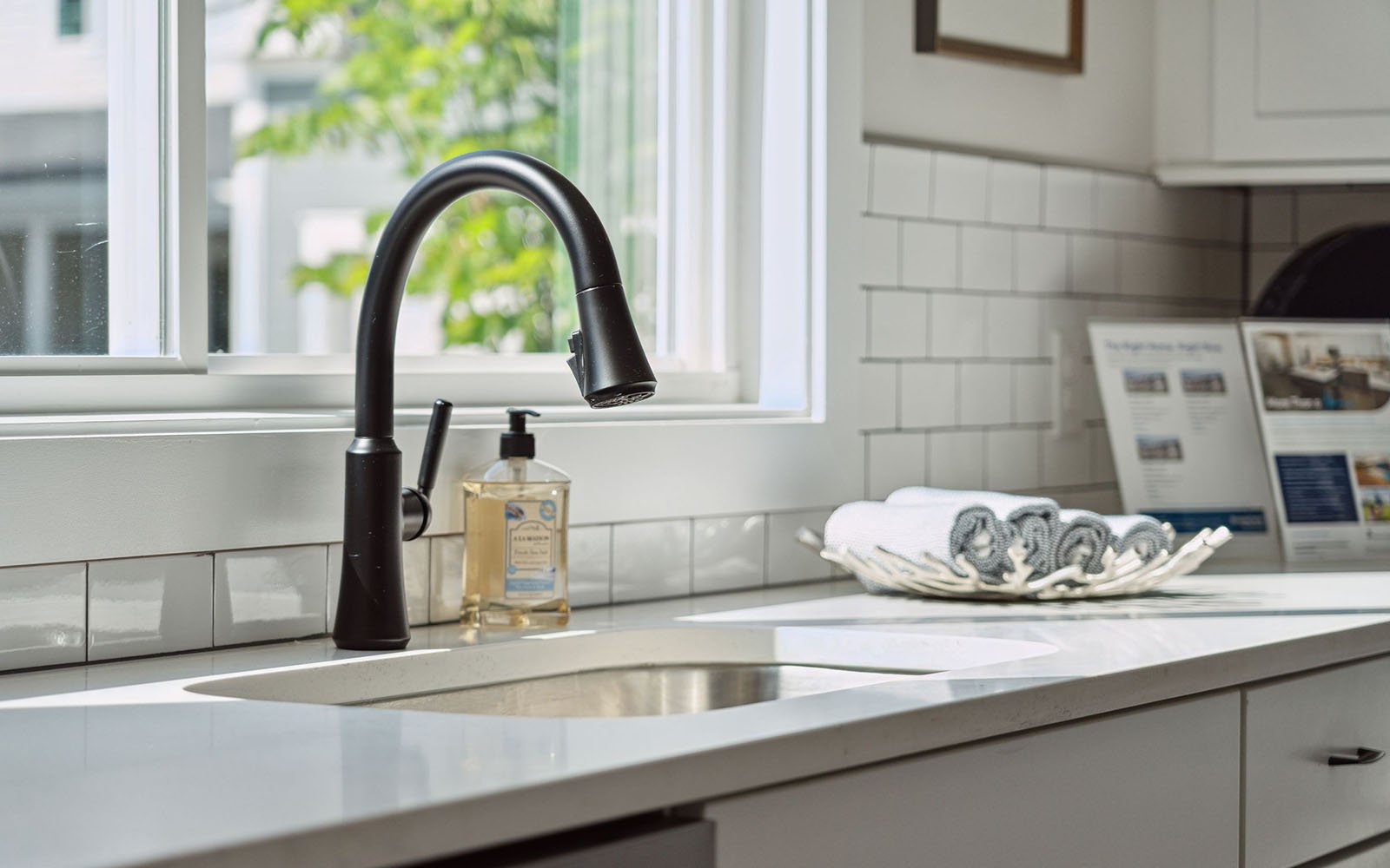 A close up of the kitchen sink and faucet in the Sage by Brookfield Residential at Nexton.