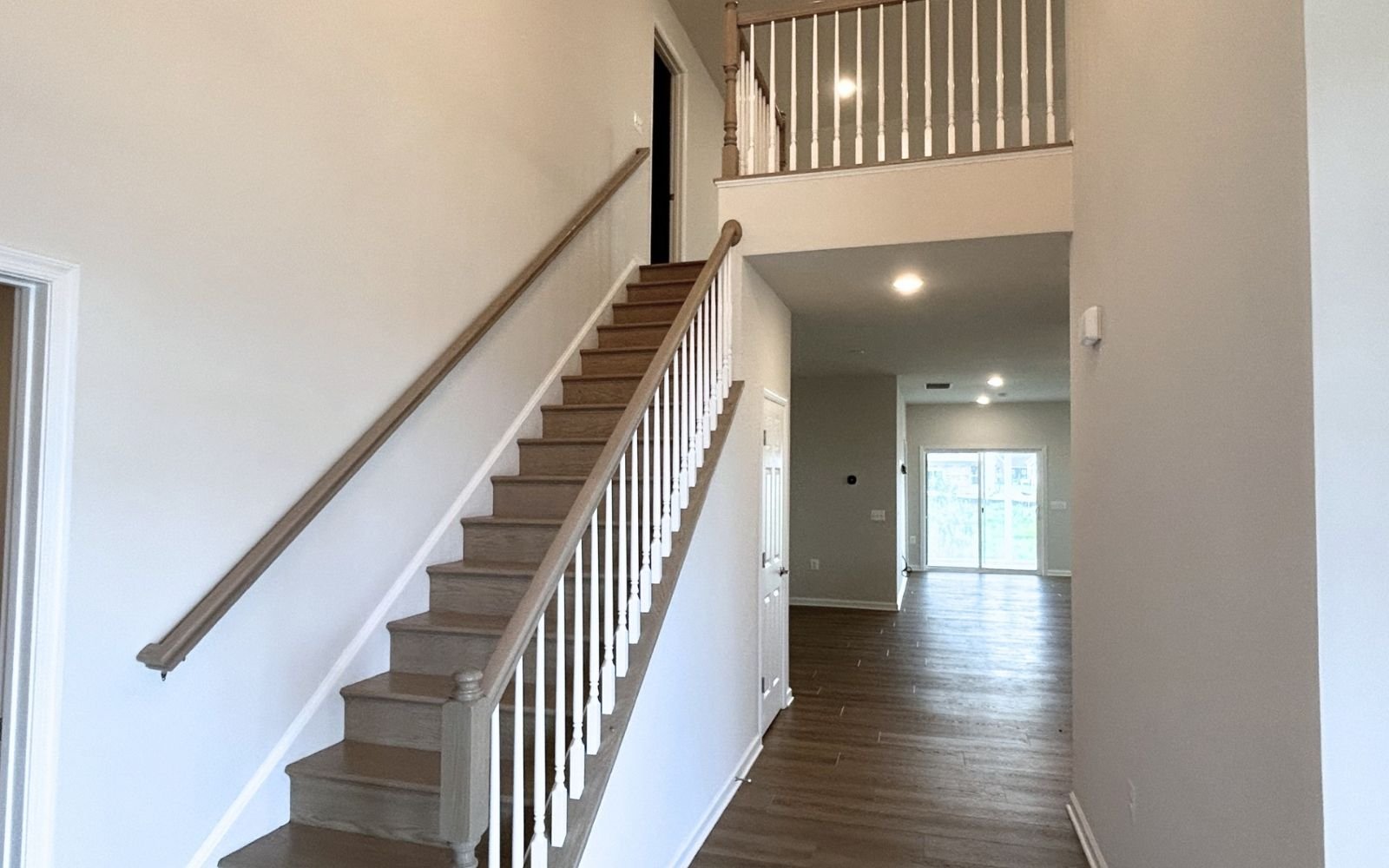The foyer view and stairs of the Fitzgerald on homesite 2001 at Hiatt Pointe at Snowden Bridge.