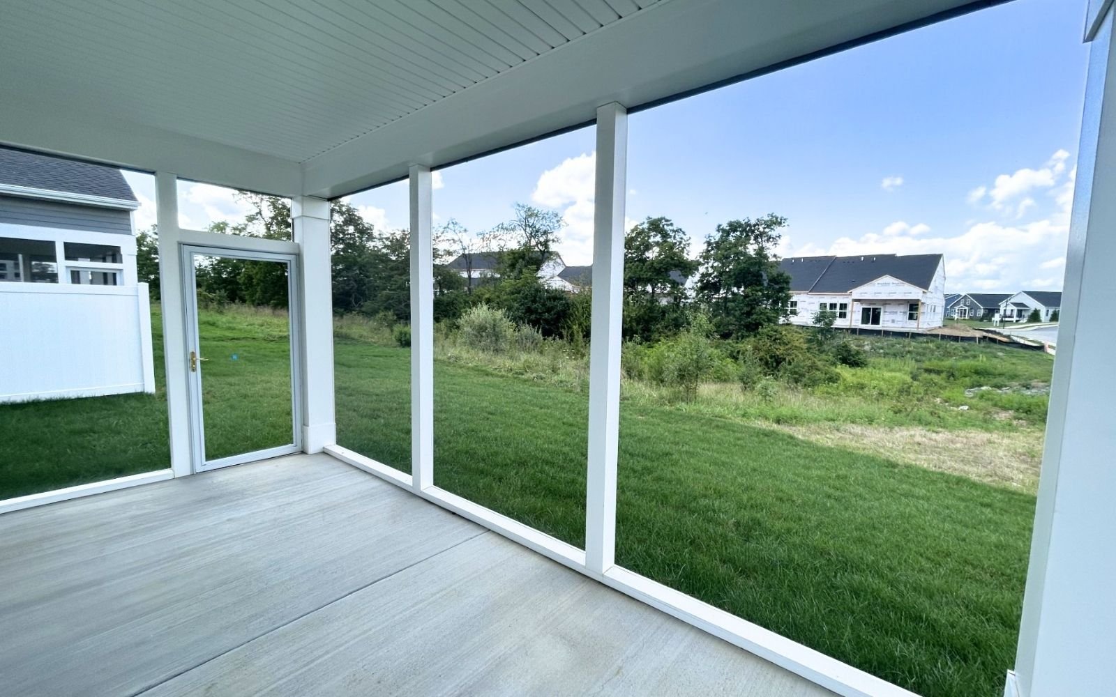 The rear screened porch of the Fitzgerald on homesite 2001 at Hiatt Pointe at Snowden Bridge.