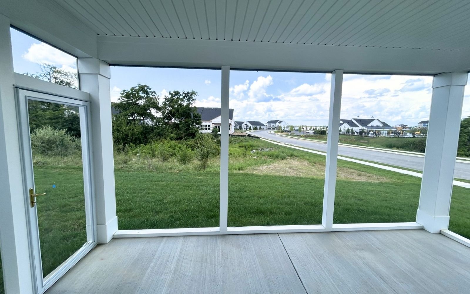 The rear screened porch of the Fitzgerald on homesite 2001 at Hiatt Pointe at Snowden Bridge.