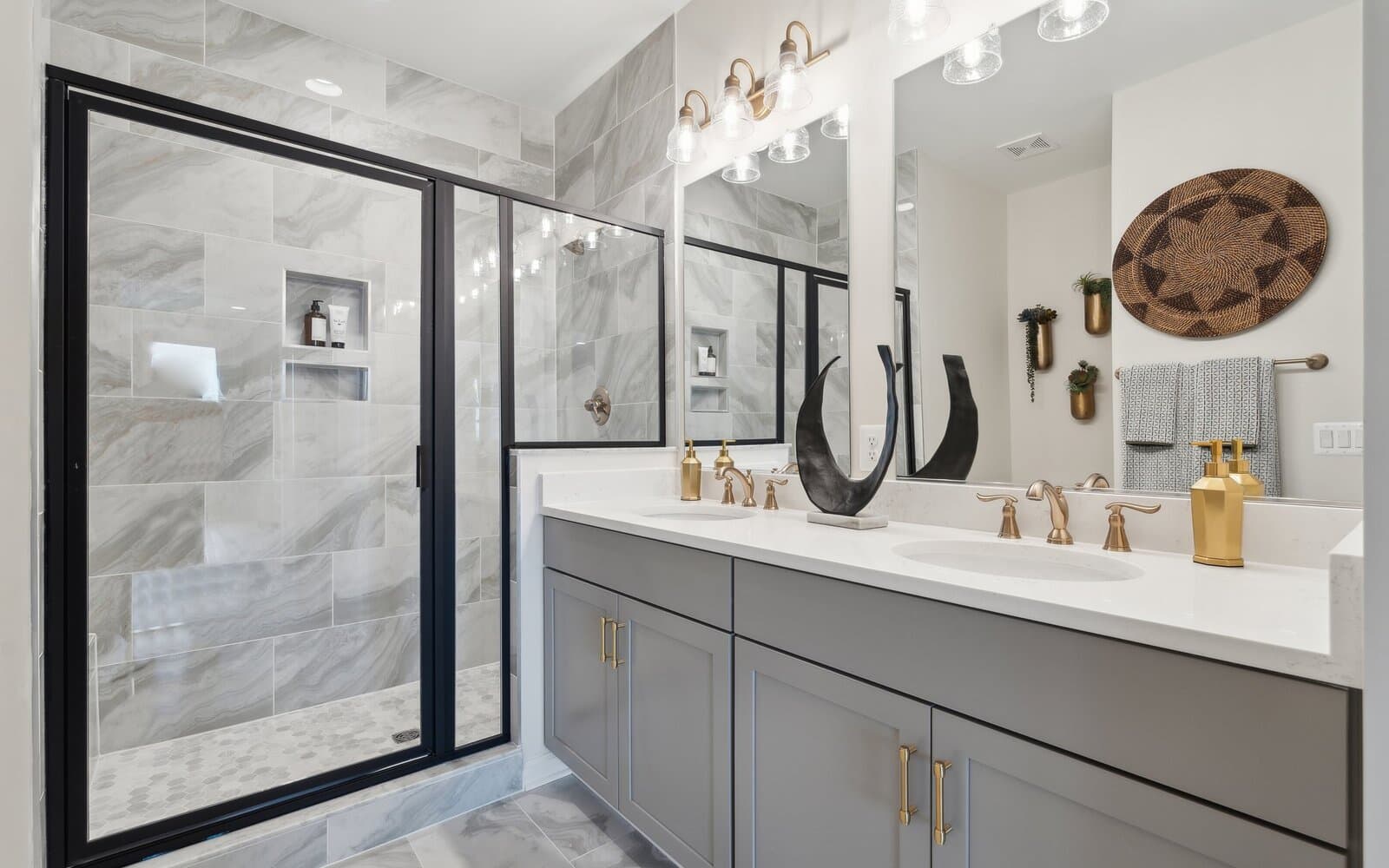 The main level primary bathroom of the Hemingway by Brookfield Residential.
