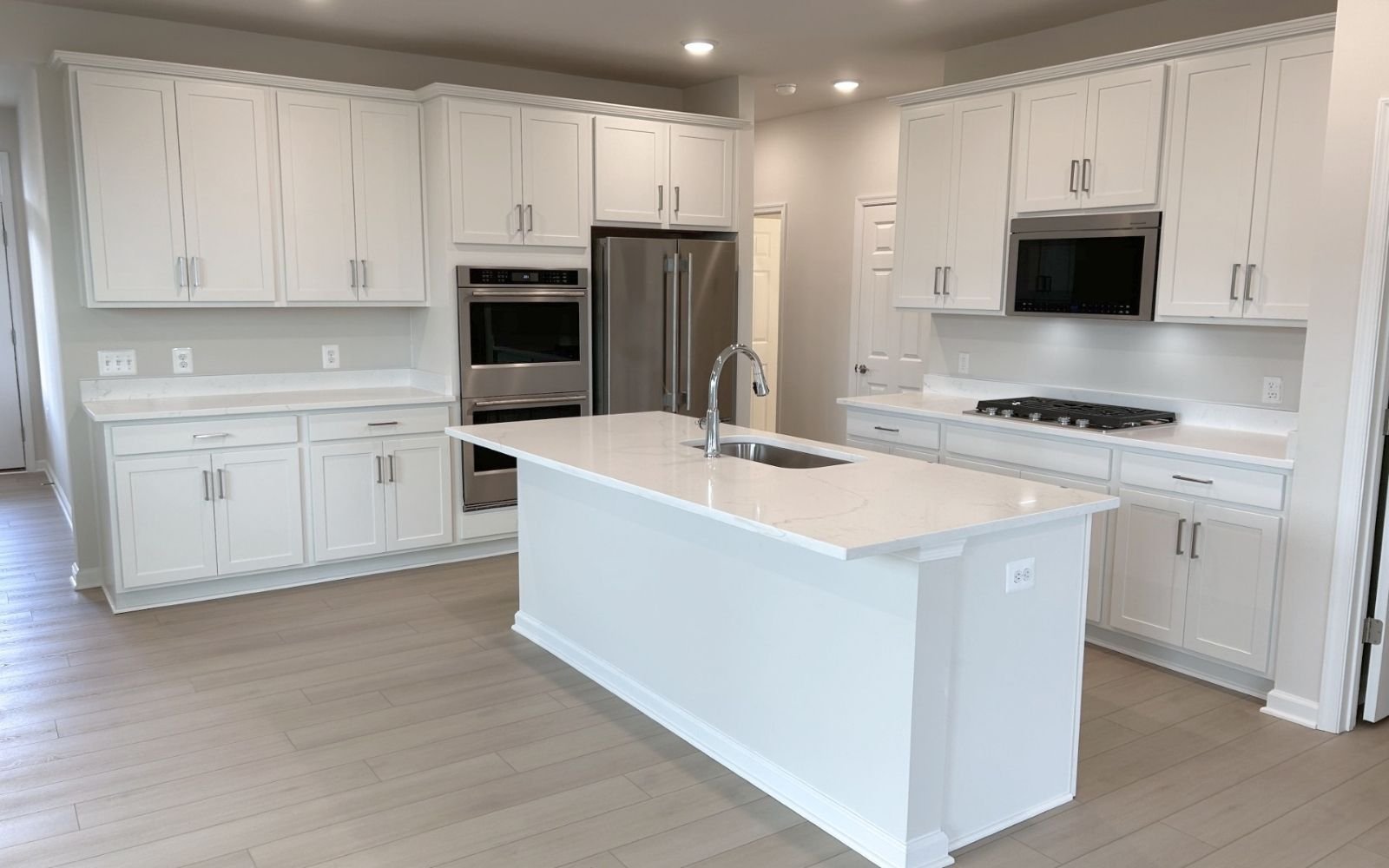 The kitchen in the Hemingway on homesite 2103 at Hiatt Pointe at Snowden Bridge.