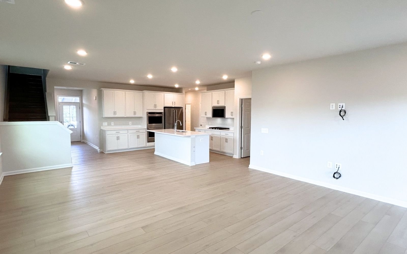 The family room and kitchen of the Hemingway on homesite 2103 at Hiatt Pointe at Snowden Bridge.