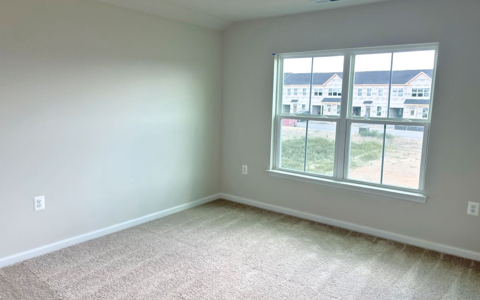 A secondary bedroom of the Hemingway on homesite 2103 at Hiatt Pointe at Snowden Bridge.