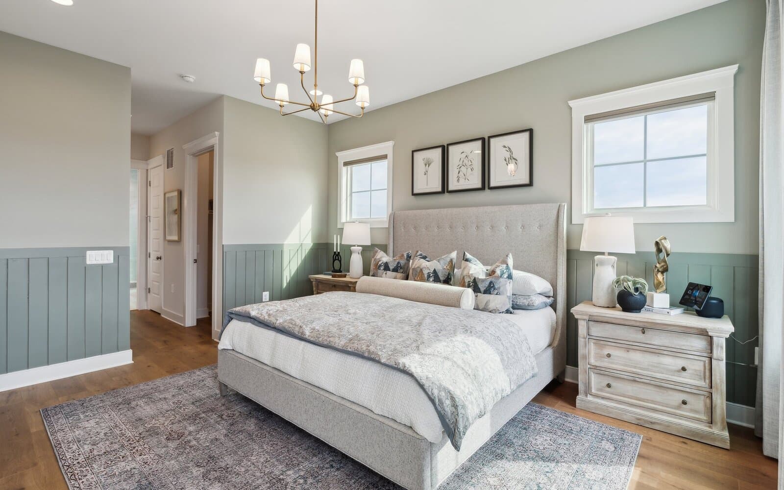The primary bedroom in the Matisse model single family home at Hiatt Pointe at Snowden Bridge by Brookfield Residential.