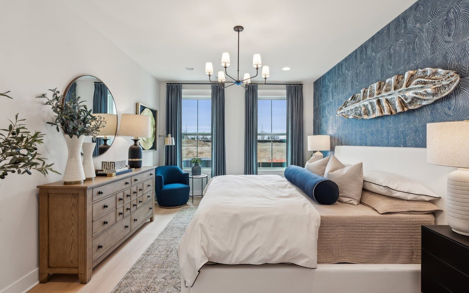 The main level primary bedroom of the Northgate by Brookfield Residential.