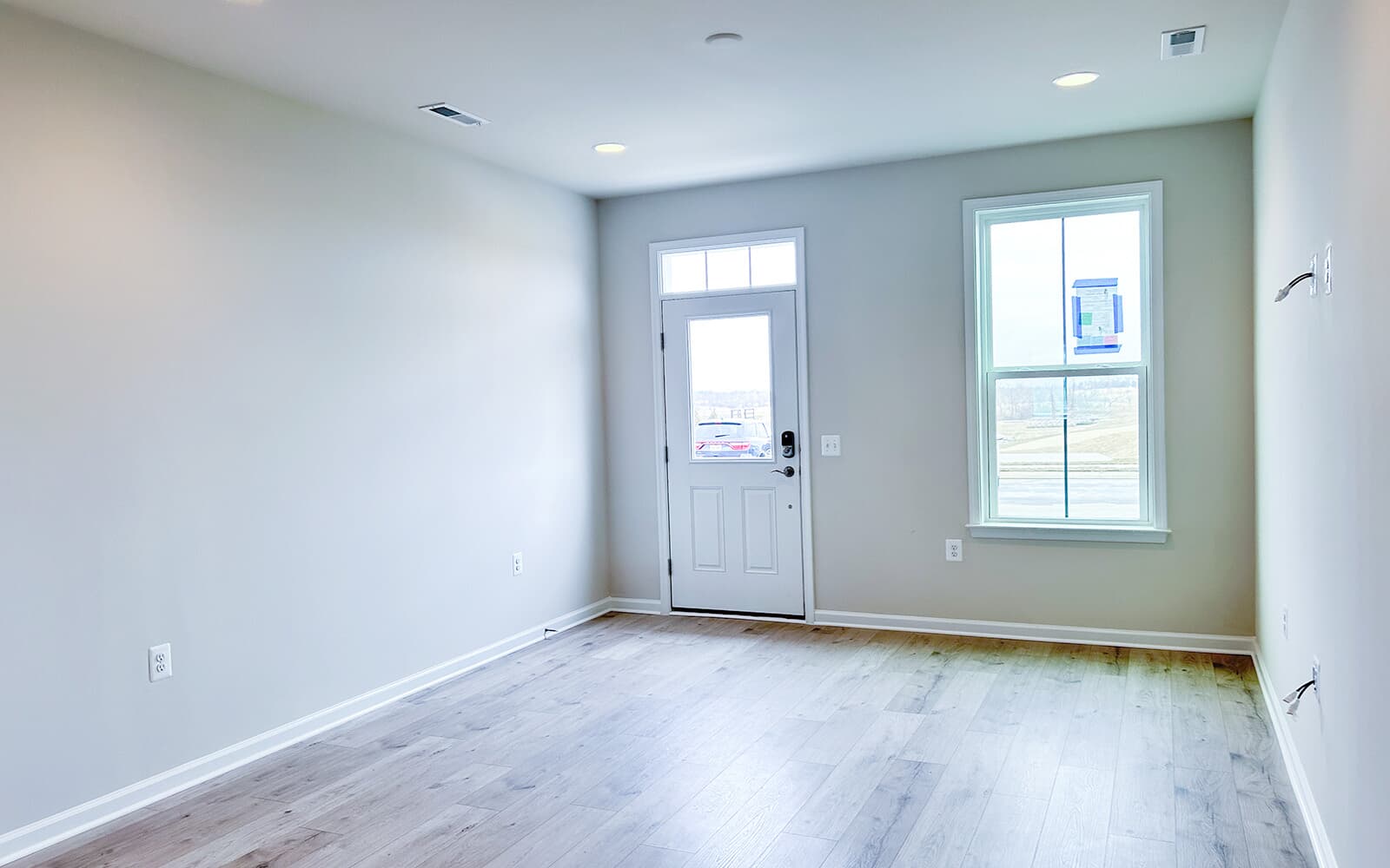 The living room in the Northgate villa home on homesite 1028 at Hiatt Pointe at Snowden Bridge by Brookfield Residential.