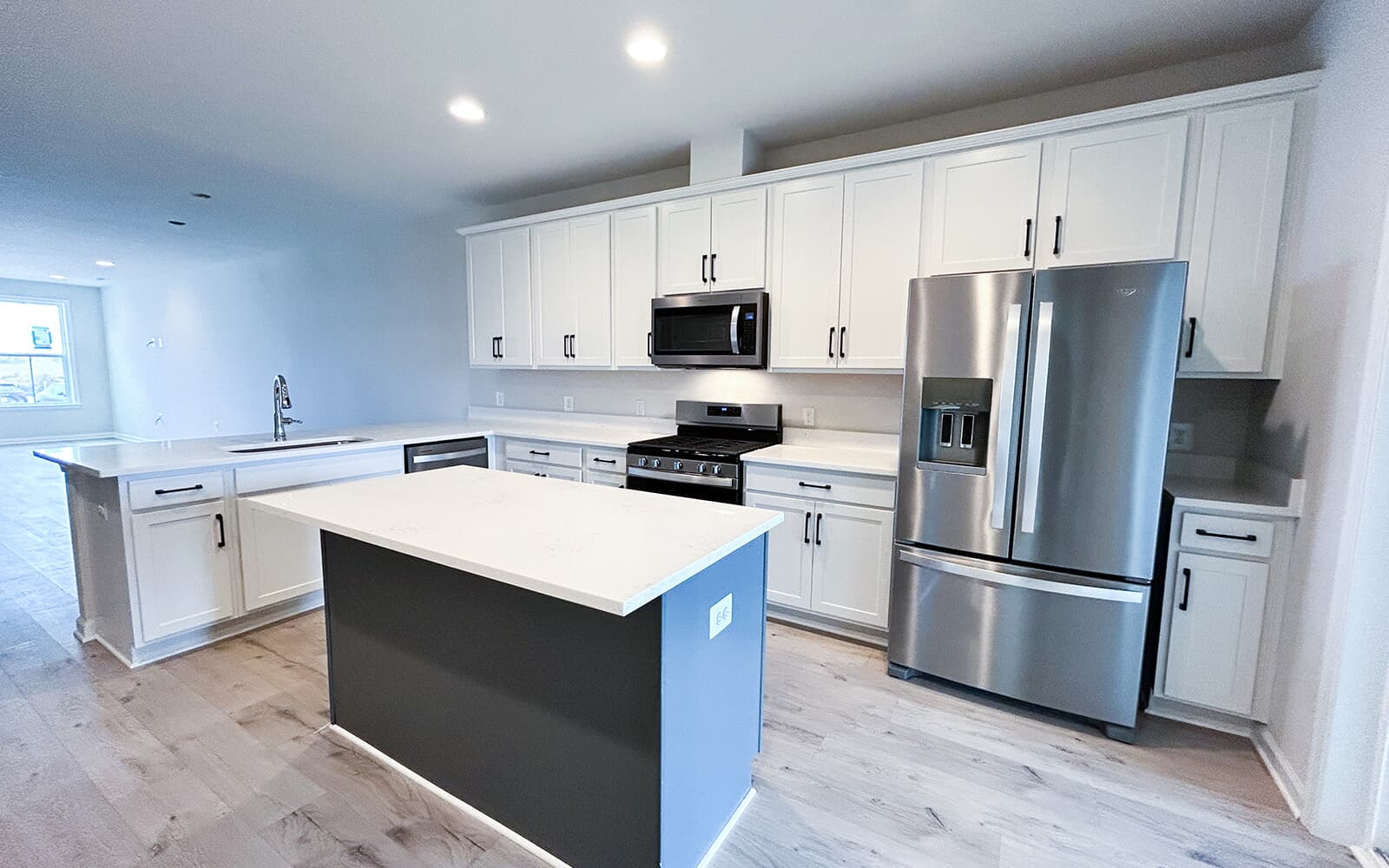 The kitchen in the Northgate villa home on homesite 1028 at Hiatt Pointe at Snowden Bridge by Brookfield Residential.