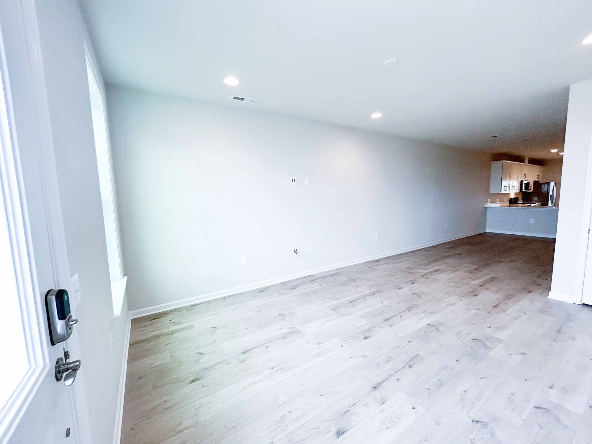The living room in the Northgate villa home on homesite 1028 at Hiatt Pointe at Snowden Bridge by Brookfield Residential.