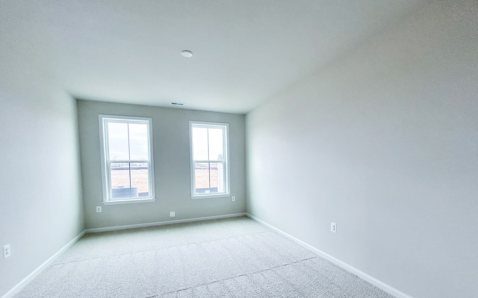 The primary bedroom in the Northgate villa home on homesite 1028 at Hiatt Pointe at Snowden Bridge by Brookfield Residential.