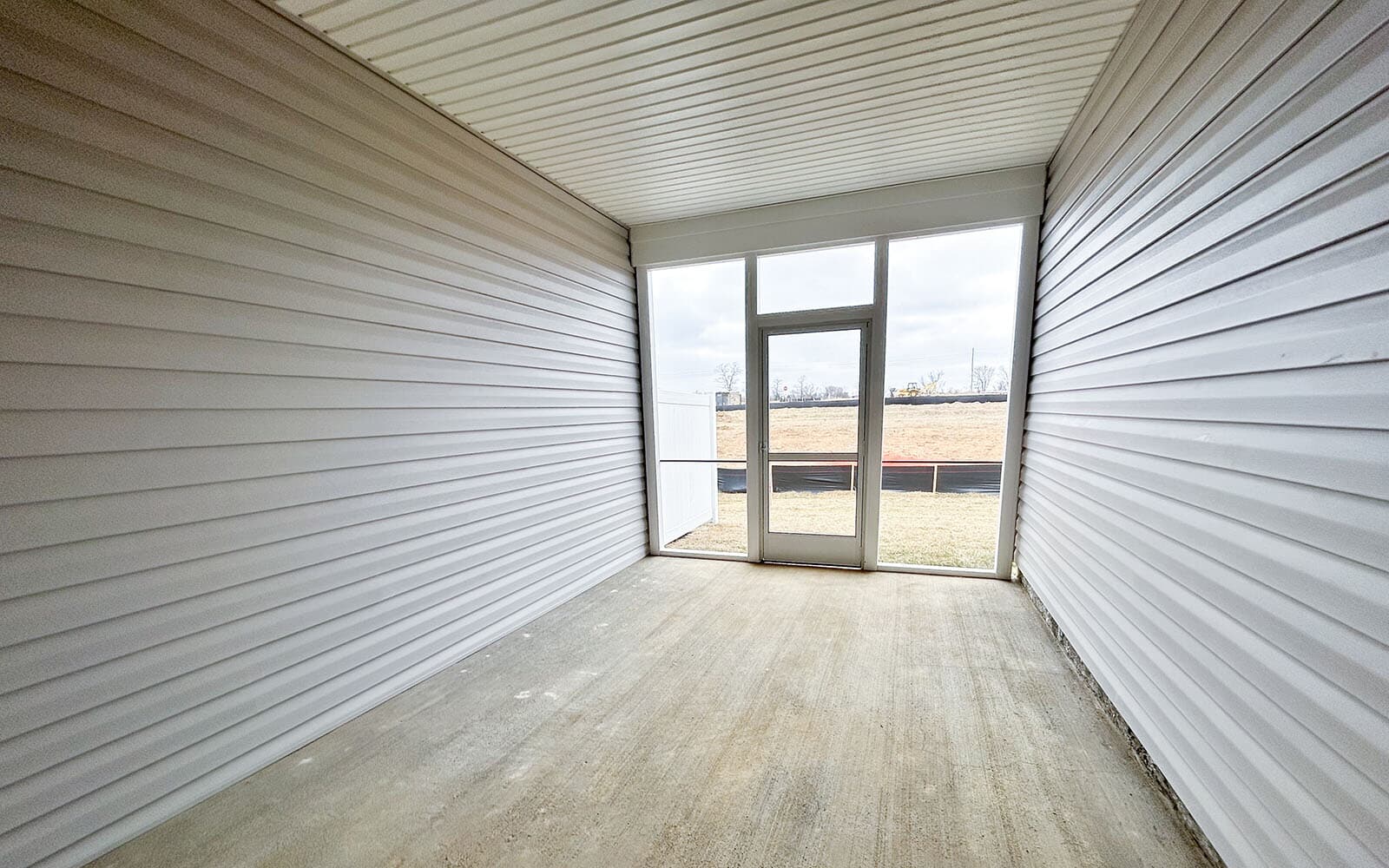 The screened porch in the Northgate villa home on homesite 1028 at Hiatt Pointe at Snowden Bridge by Brookfield Residential.
