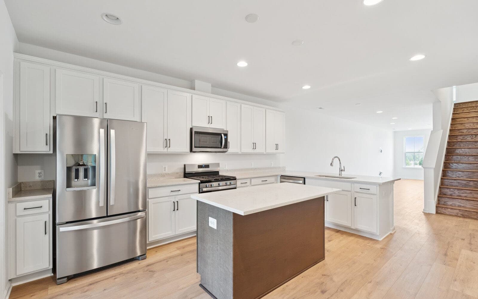The kitchen of the Northgate by Brookfield Residential on homesite 1002 at Hiatt Pointe at Snowden Bridge.
