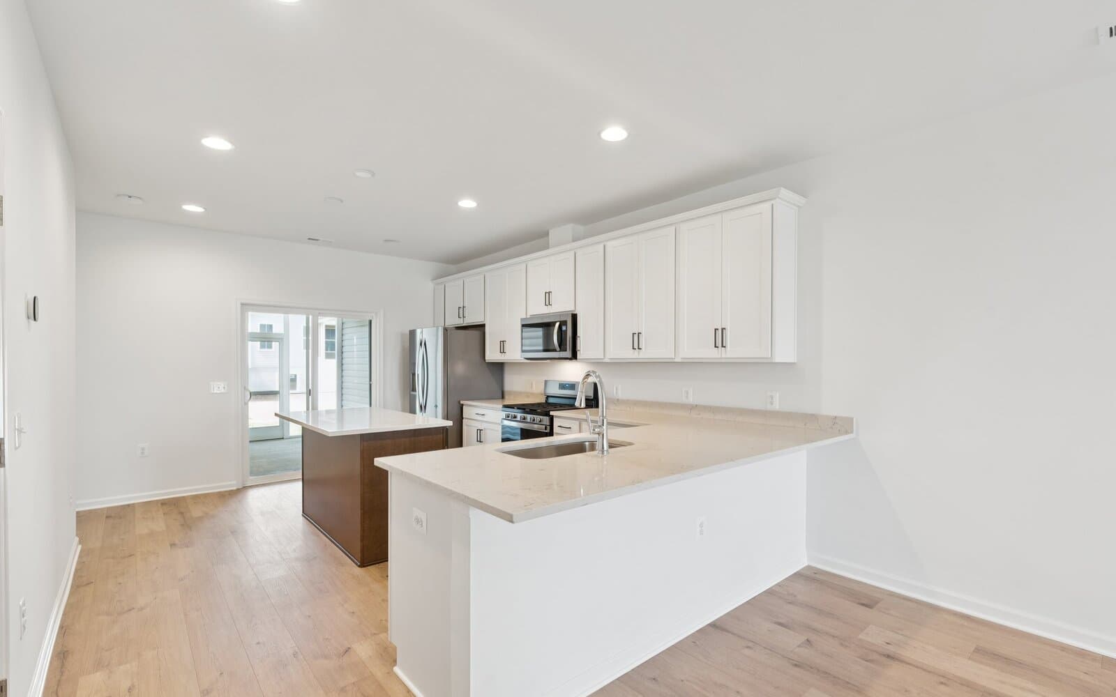 The kitchen of the Northgate by Brookfield Residential on homesite 1002 at Hiatt Pointe at Snowden Bridge.