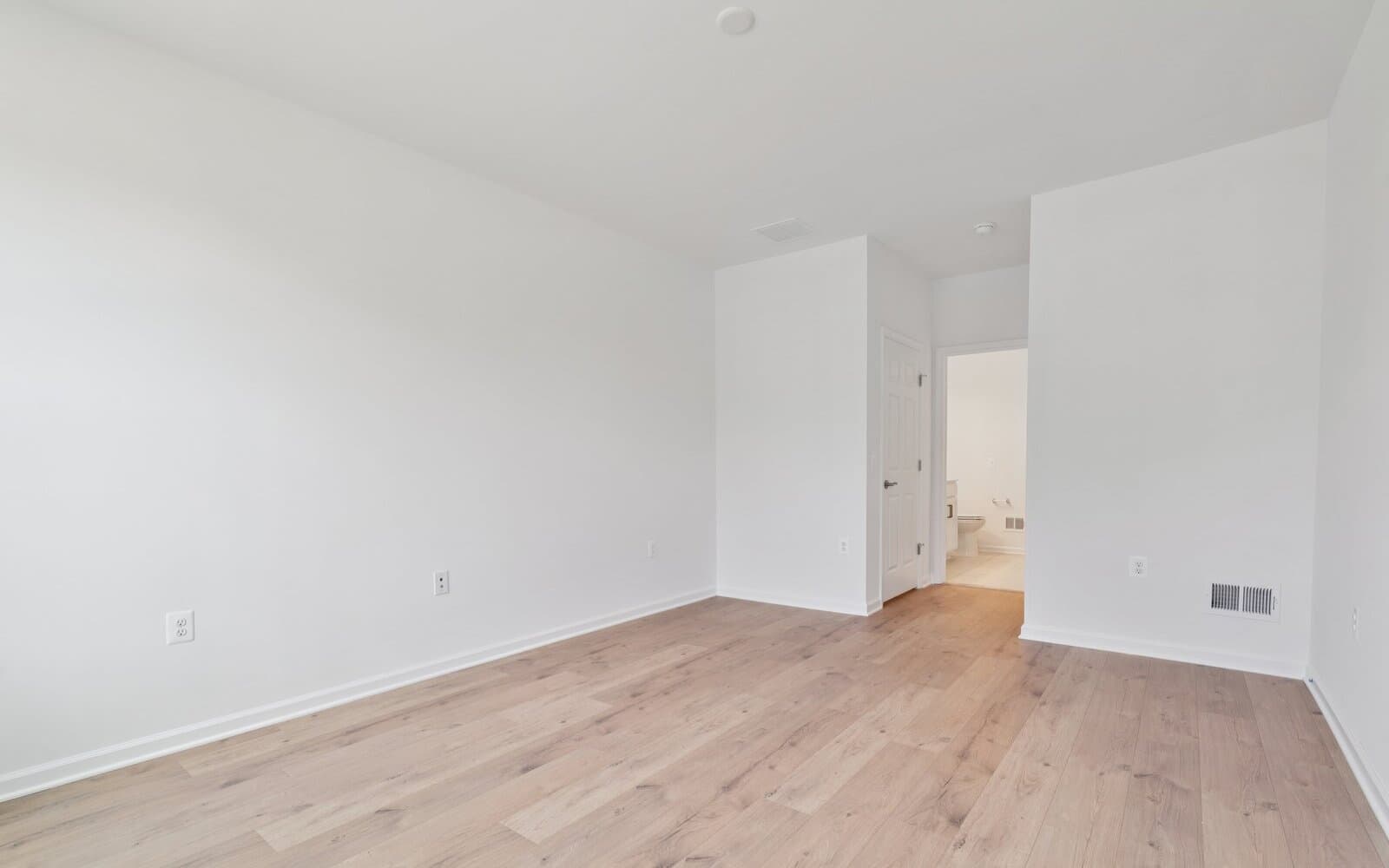 The main level primary suite of the Northgate by Brookfield Residential on homesite 1002 at Hiatt Pointe at Snowden Bridge.