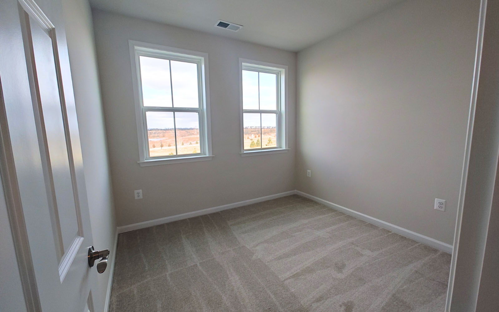 A secondary bedroom of the Northgate on homesite 1009 at Hiatt Pointe at Snowden Bridge.