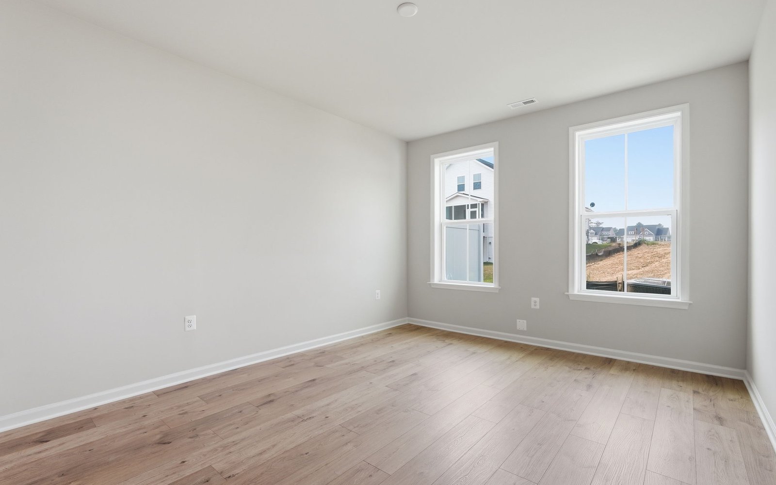 The main level primary bedroom of the Northgate on homesite 1009 at Hiatt Pointe at Snowden Bridge.