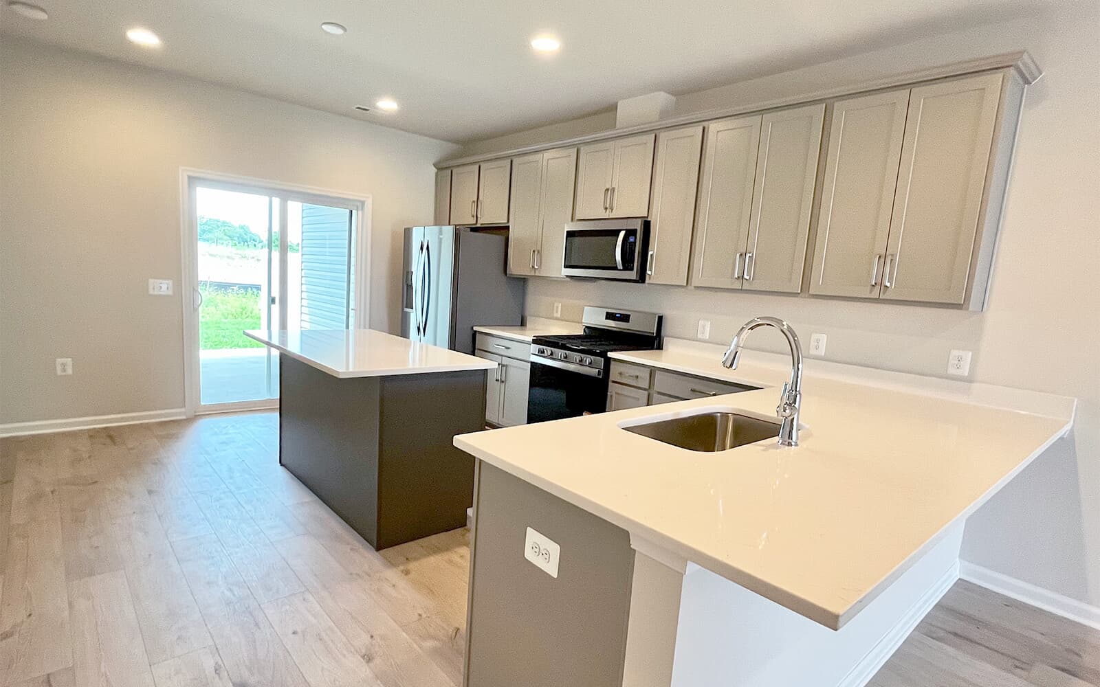 The kitchen in the Northgate on homesite 1012 at Hiatt Pointe at Snowden Bridge by Brookfield Residential.