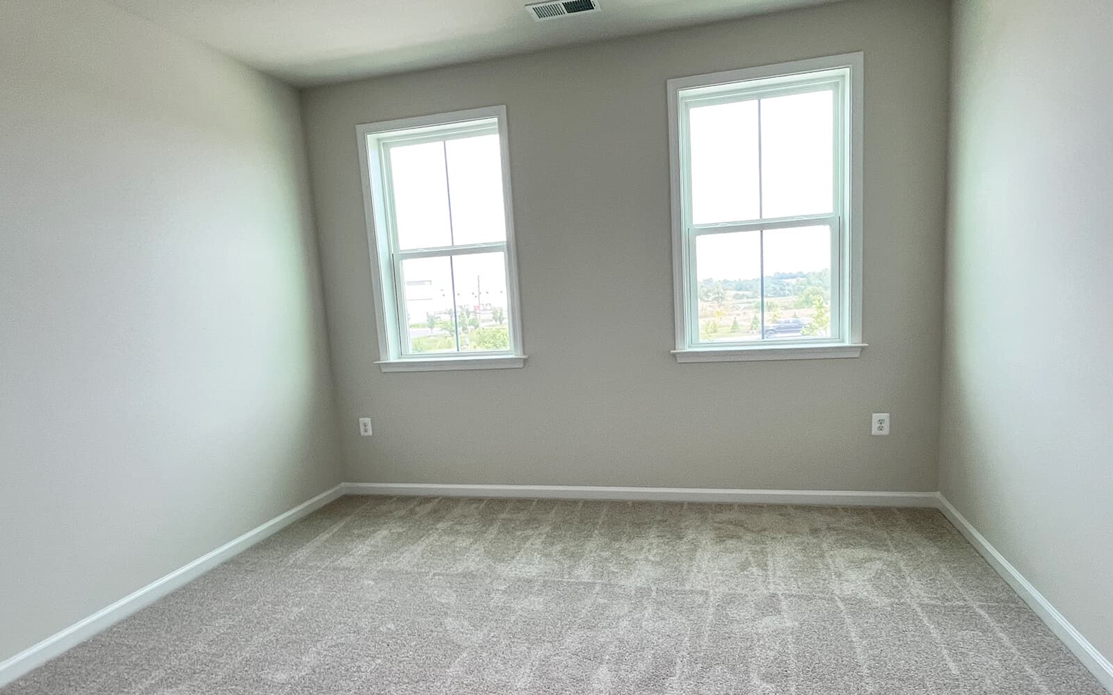 A secondary bedroom in the Northgate on homesite 1012 at Hiatt Pointe at Snowden Bridge by Brookfield Residential.