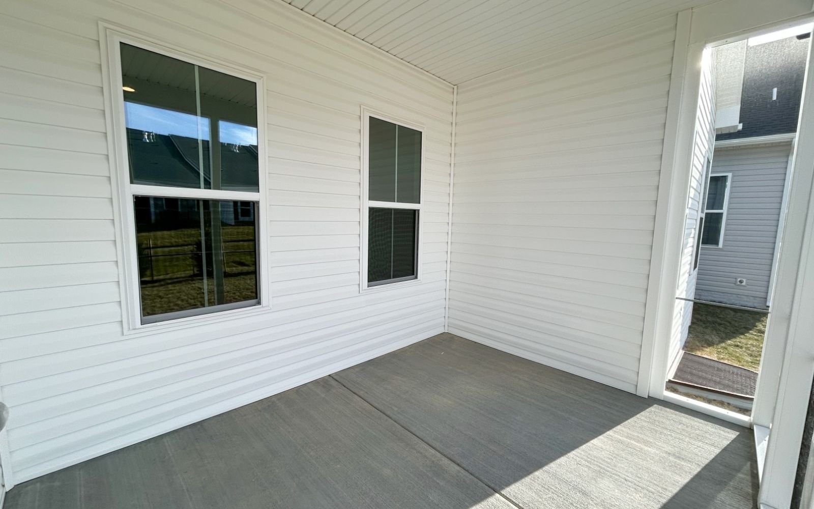 The screened porch in the Matisse on homesite 1120 at Hiatt Pointe at Snowden Bridge.