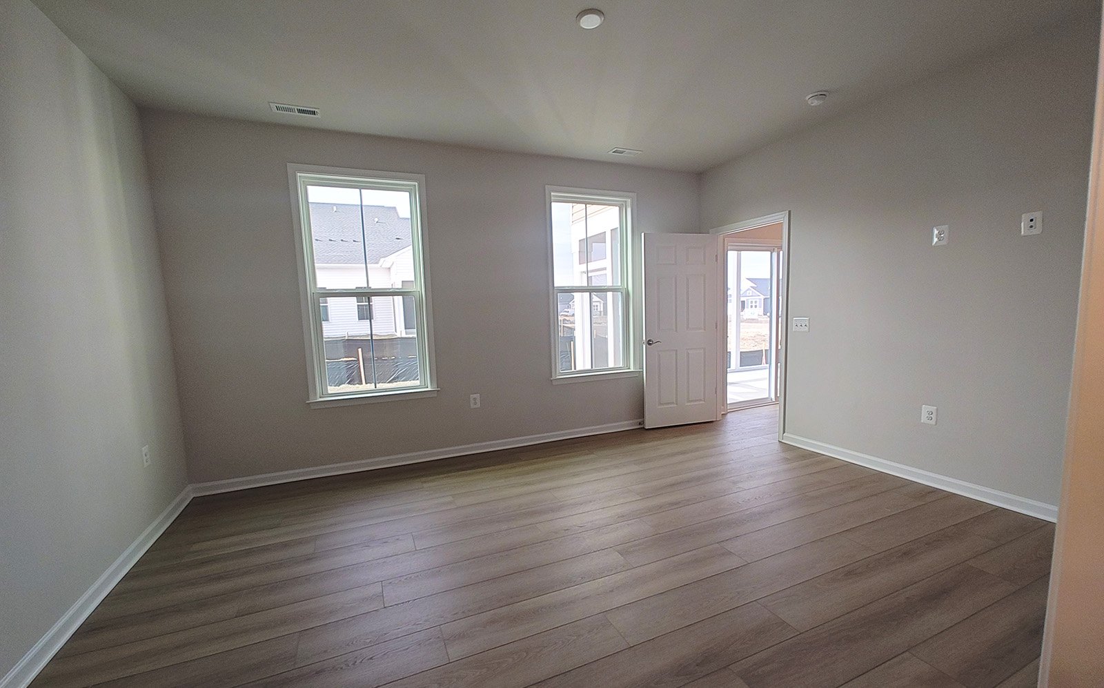 The main level primary bedroom of the Fitzgerald on homesite 2120.