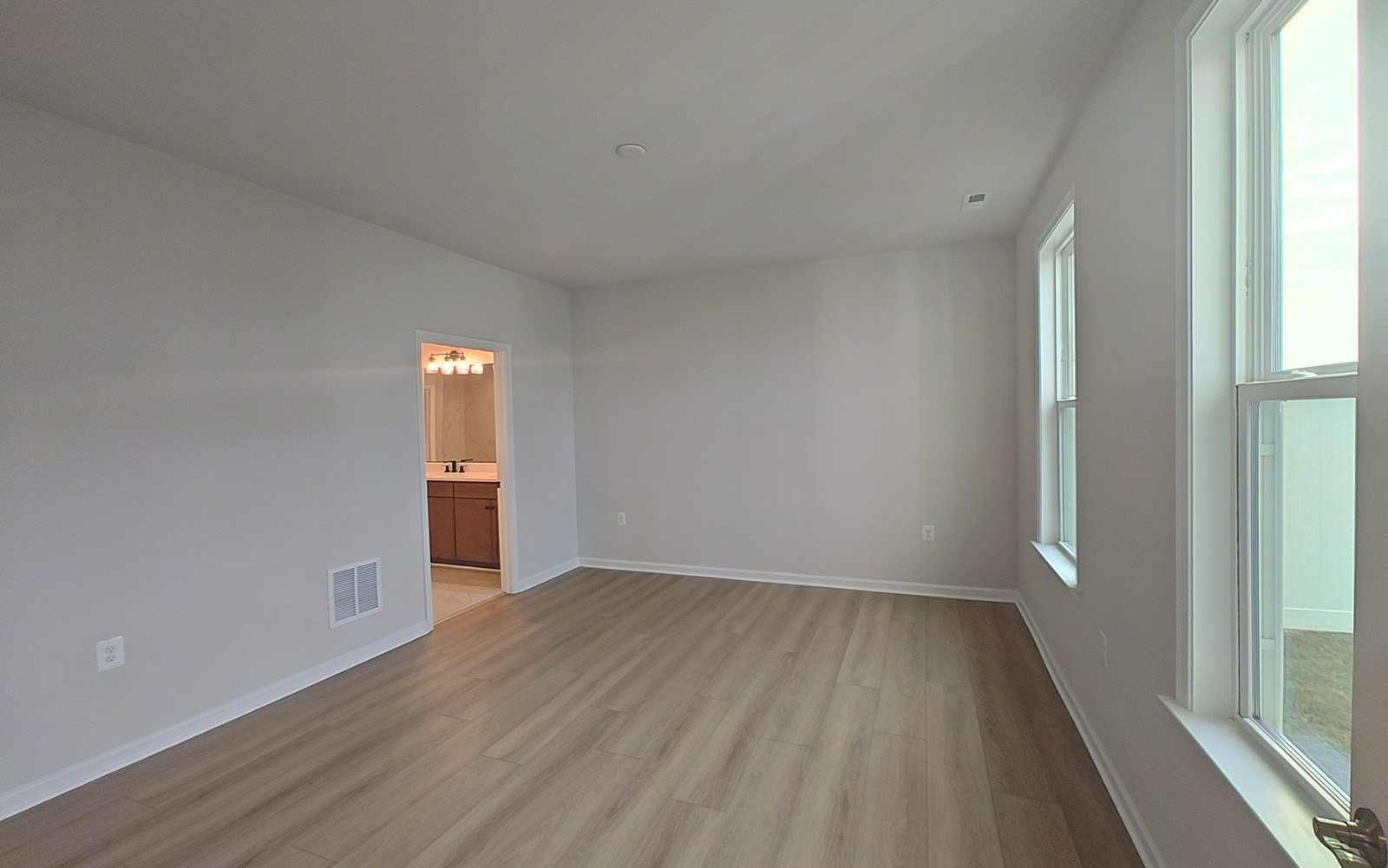 The main level primary bedroom of the Fitzgerald on homesite 2120.