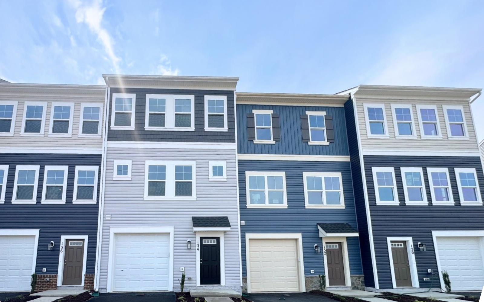 The exterior of the Skyline townhome on homesite 24024 at Snowden Bridge by Brookfield Residential.