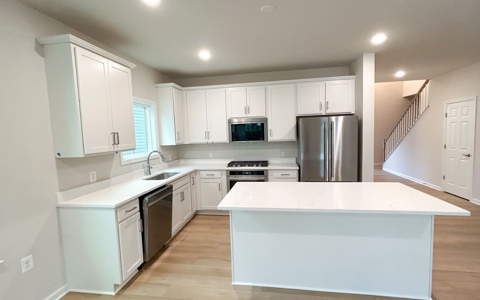 The kitchen of the Fitzgerald on homesite 2003 at Hiatt Pointe at Snowden Bridge.