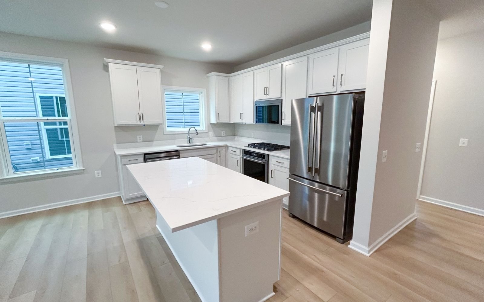 The kitchen of the Fitzgerald on homesite 2003 at Hiatt Pointe at Snowden Bridge.