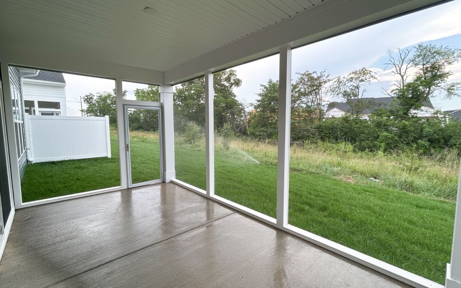 The screened porch of the Fitzgerald on homesite 2003 at Hiatt Pointe at Snowden Bridge.