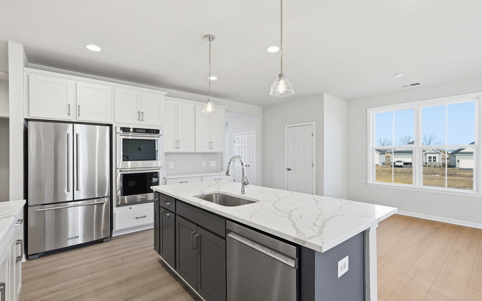 The kitchen of the Hemingway on homesite 2111 at Hiatt Pointe at Snowden Bridge.
