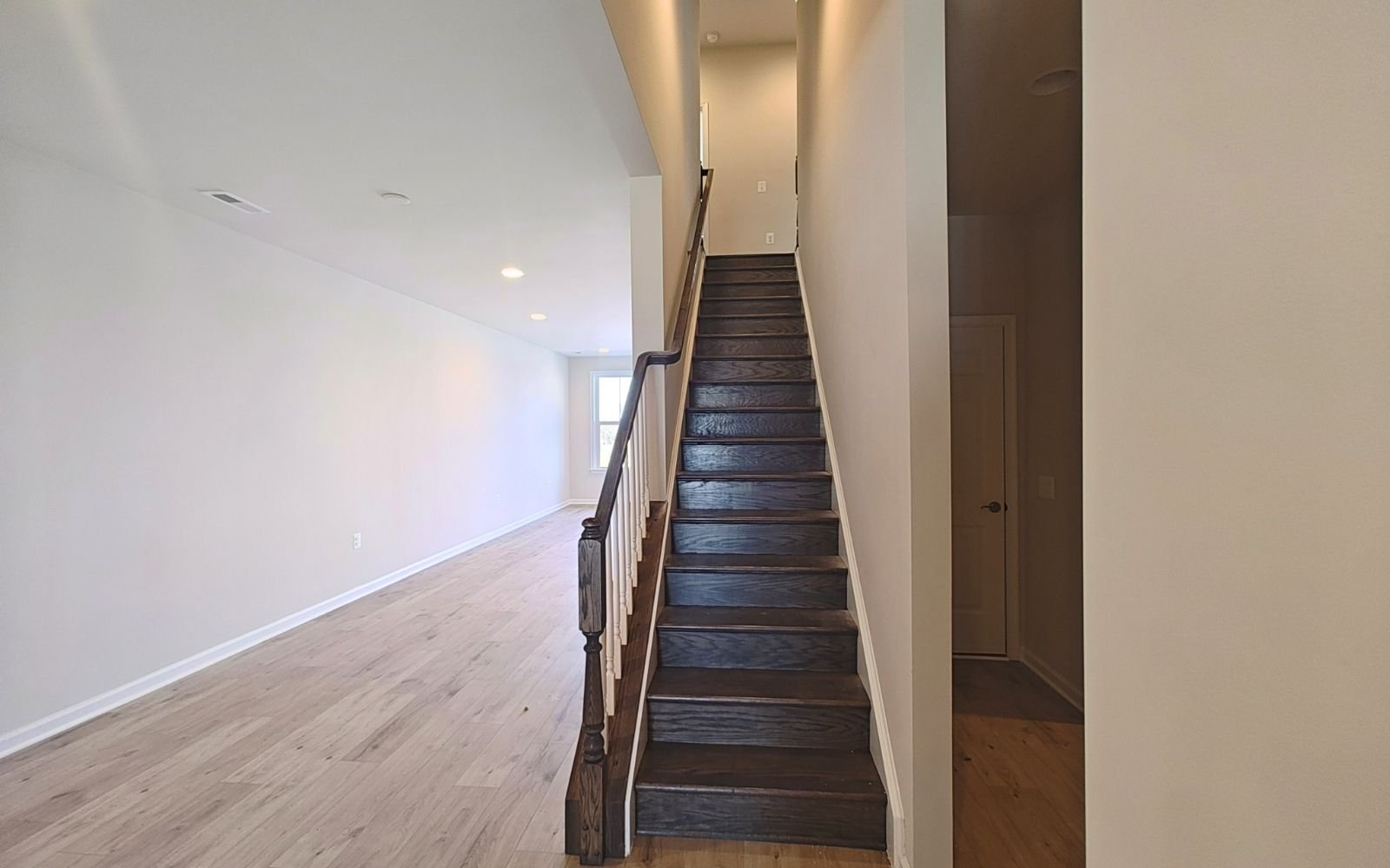 The stairs to the upper level of the Northgate on homesite 1008 at Hiatt Pointe at Snowden Bridge.