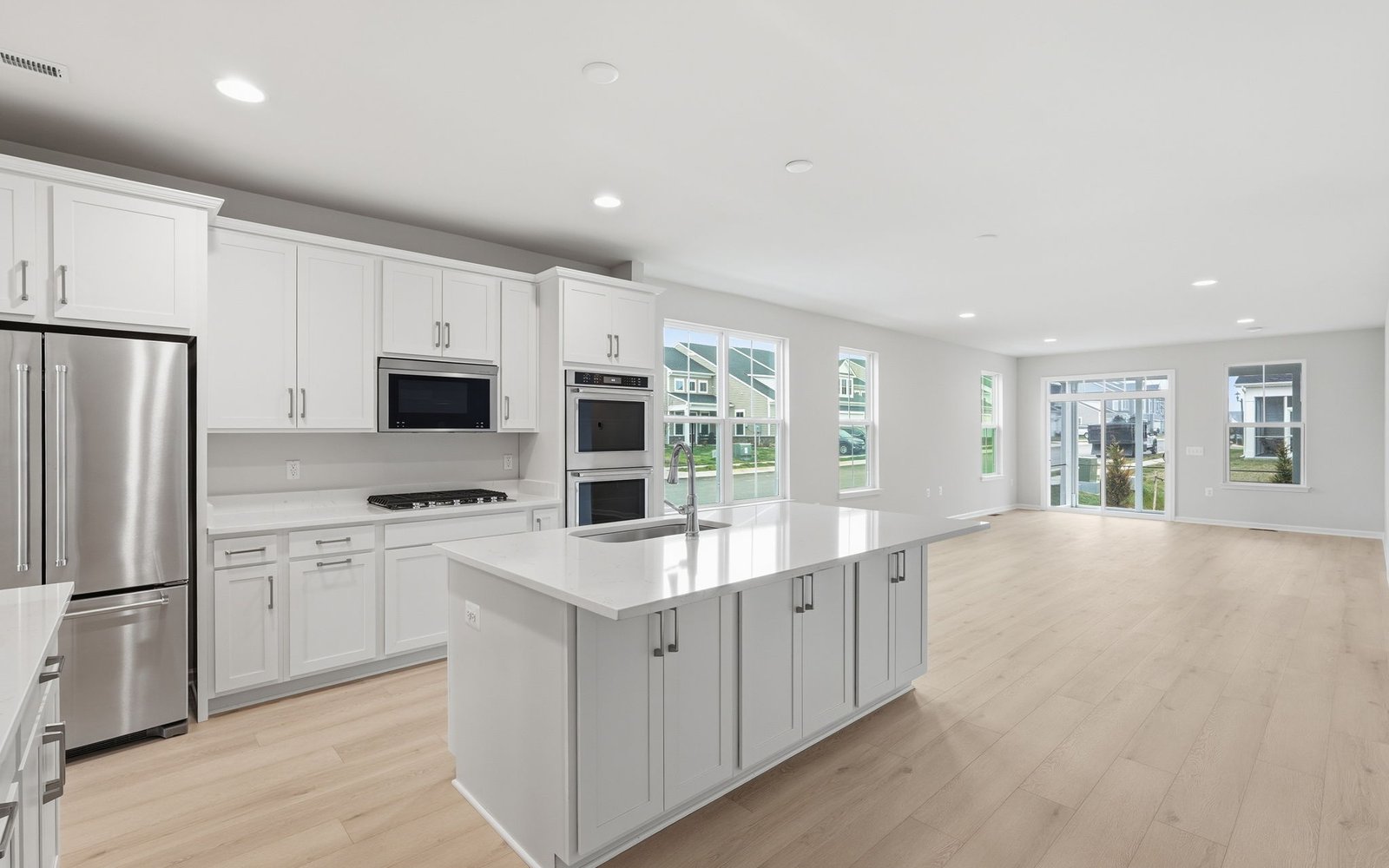 The kitchen and family room of the Rockwell on homesite 1121 at Hiatt Pointe at Snowden Bridge.