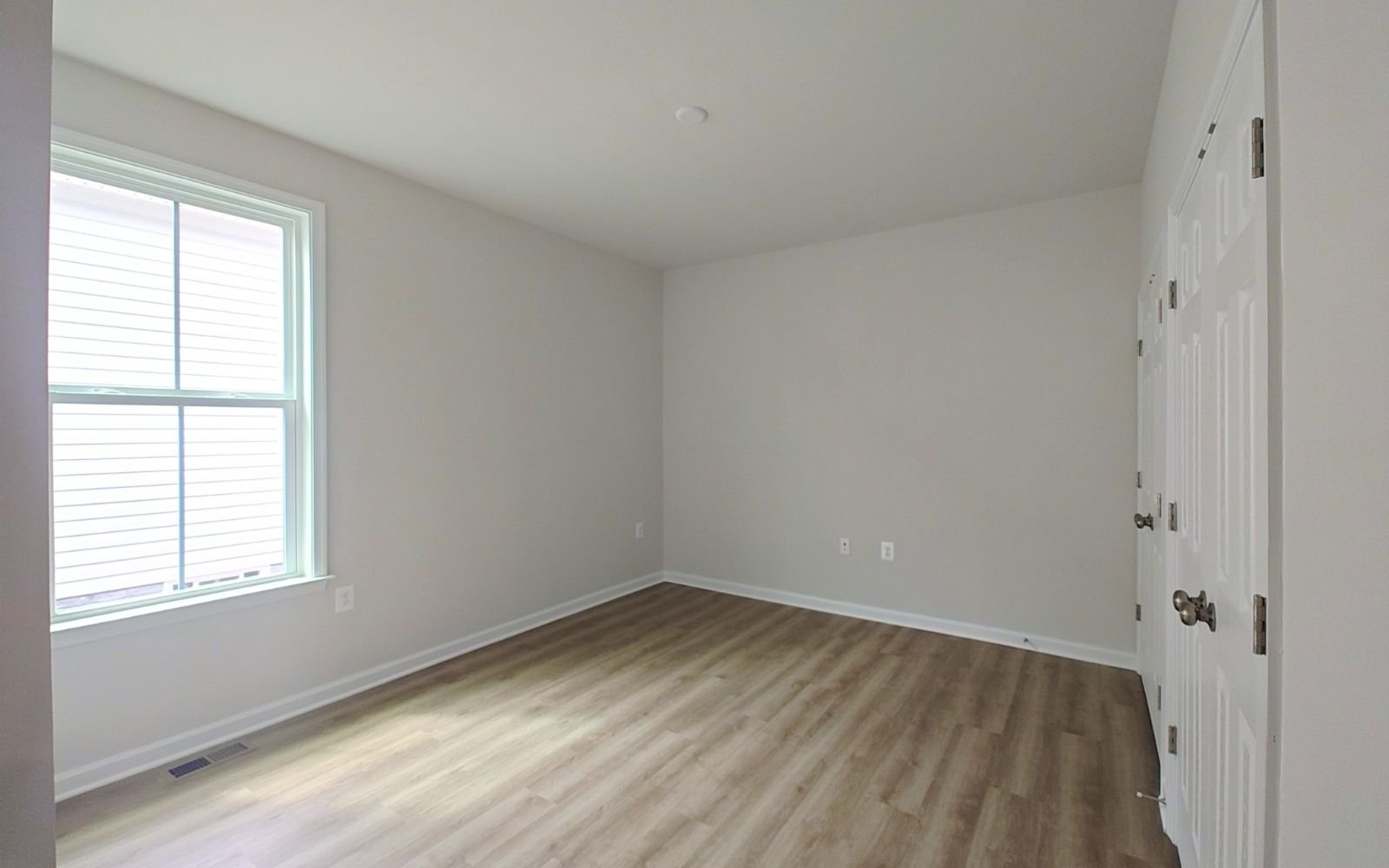 A secondary bedroom in the Rockwell on homesite 2127 at Hiatt Pointe at Snowden Bridge.