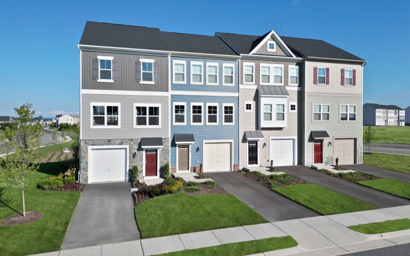 The exterior of the Skyline townhome by Brookfield Residential at Snowden Bridge II.