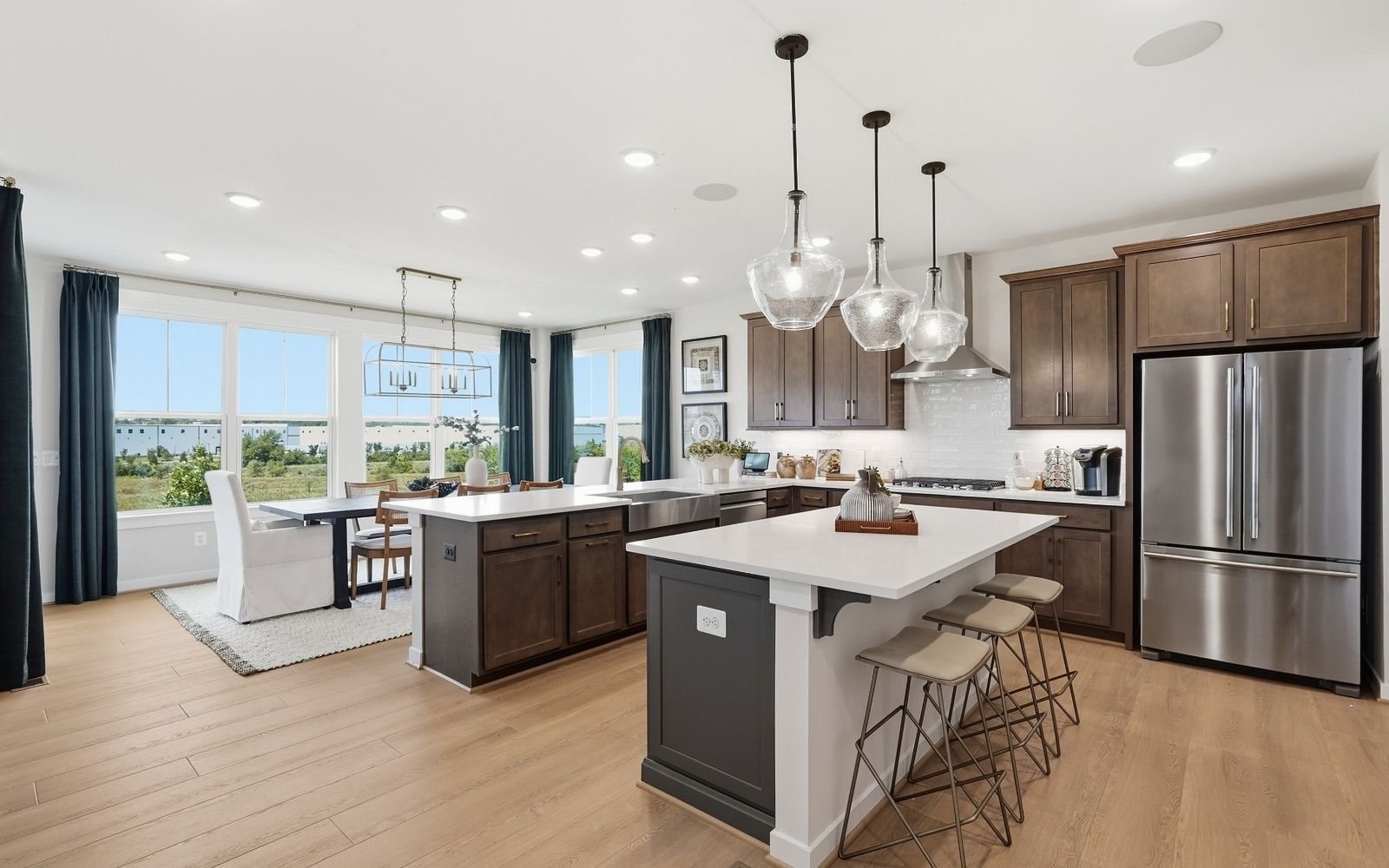 The kitchen and dining room of the Sinclair model home at Snowden Bridge.