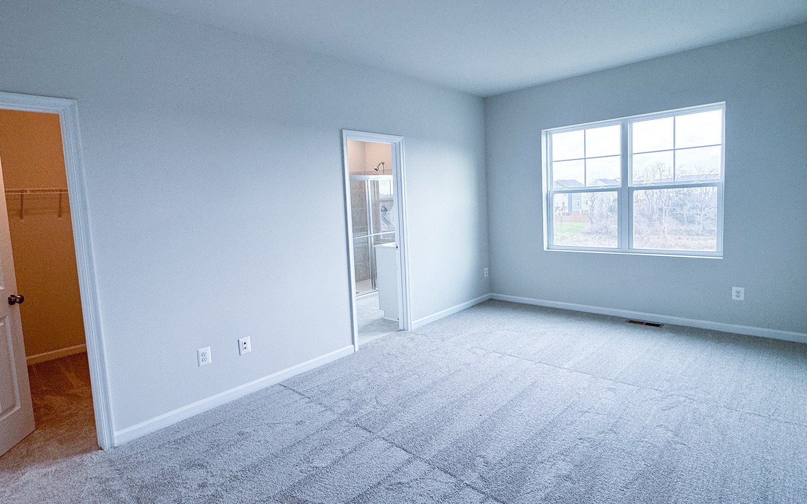 The primary bedroom of the Skyline on homesite 2153 at Snowden Bridge.