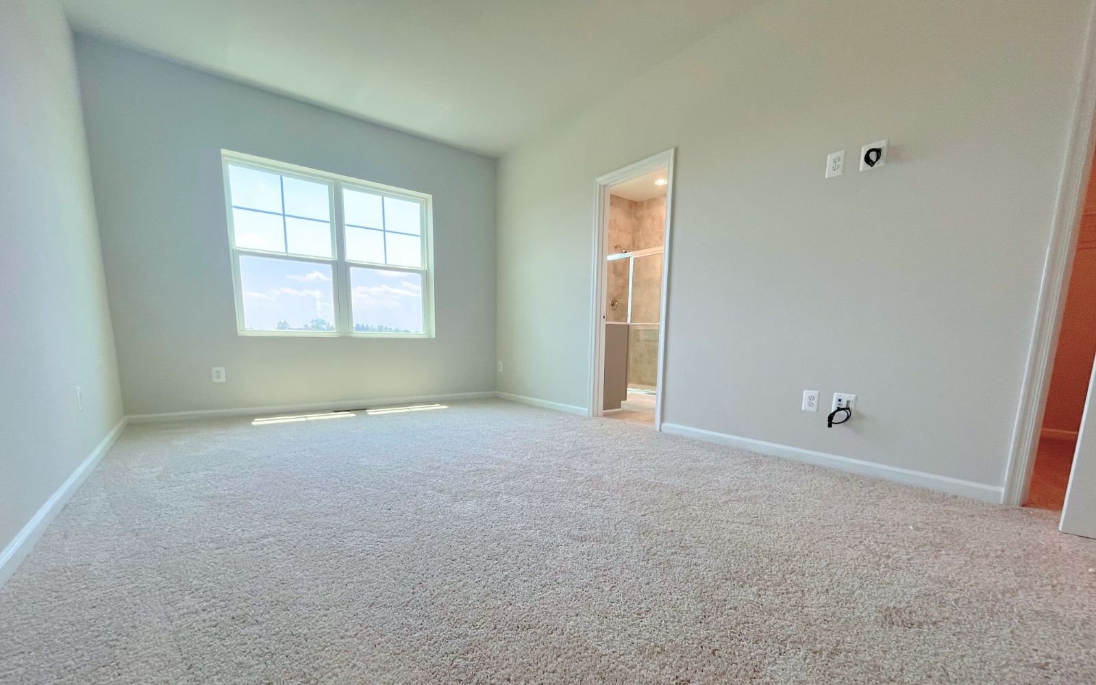 The primary bedroom of the Skyline on homesite 24016 at Snowden Bridge.