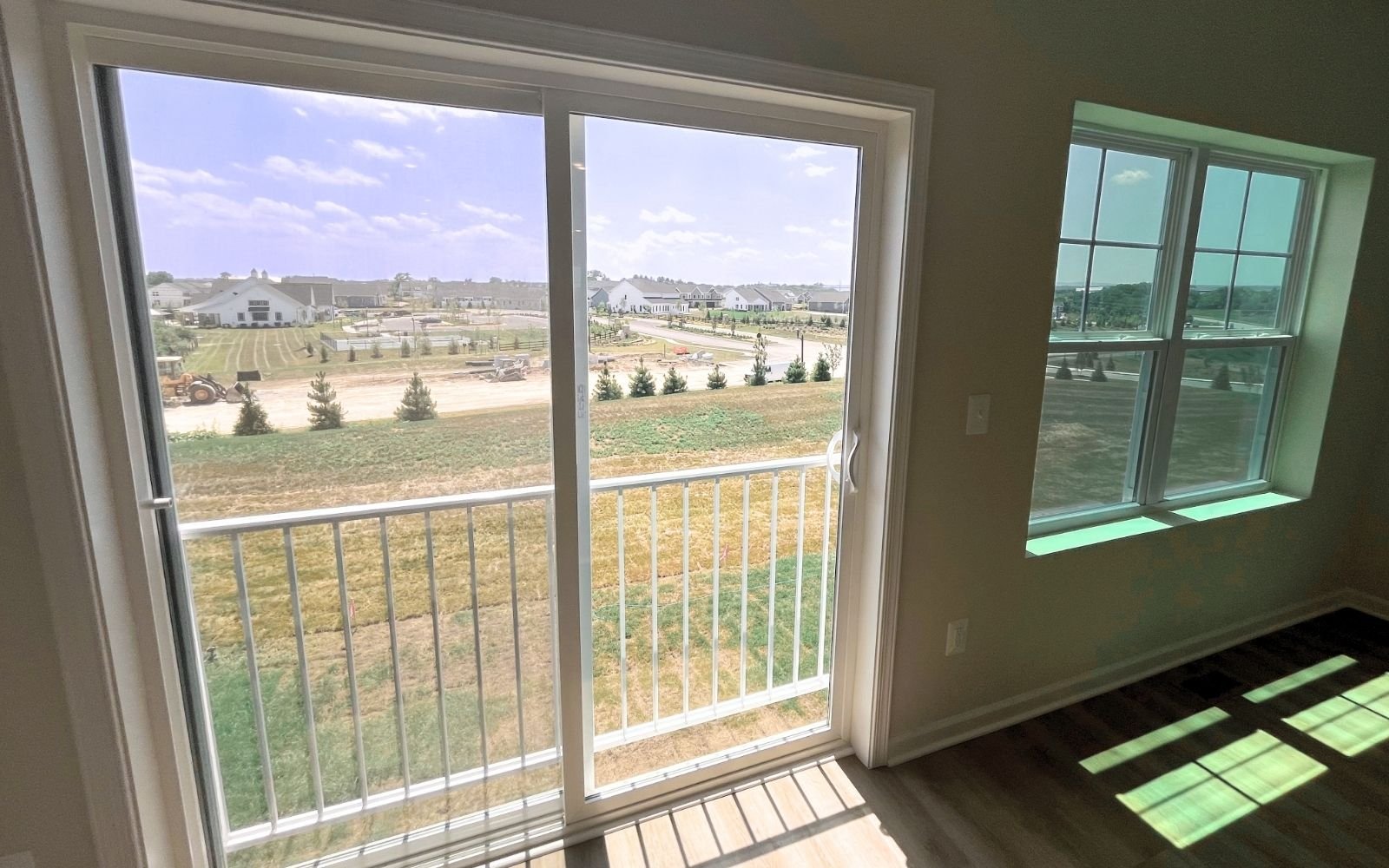 The rear view from the main level of the Skyline on homesite 24016 at Snowden Bridge.