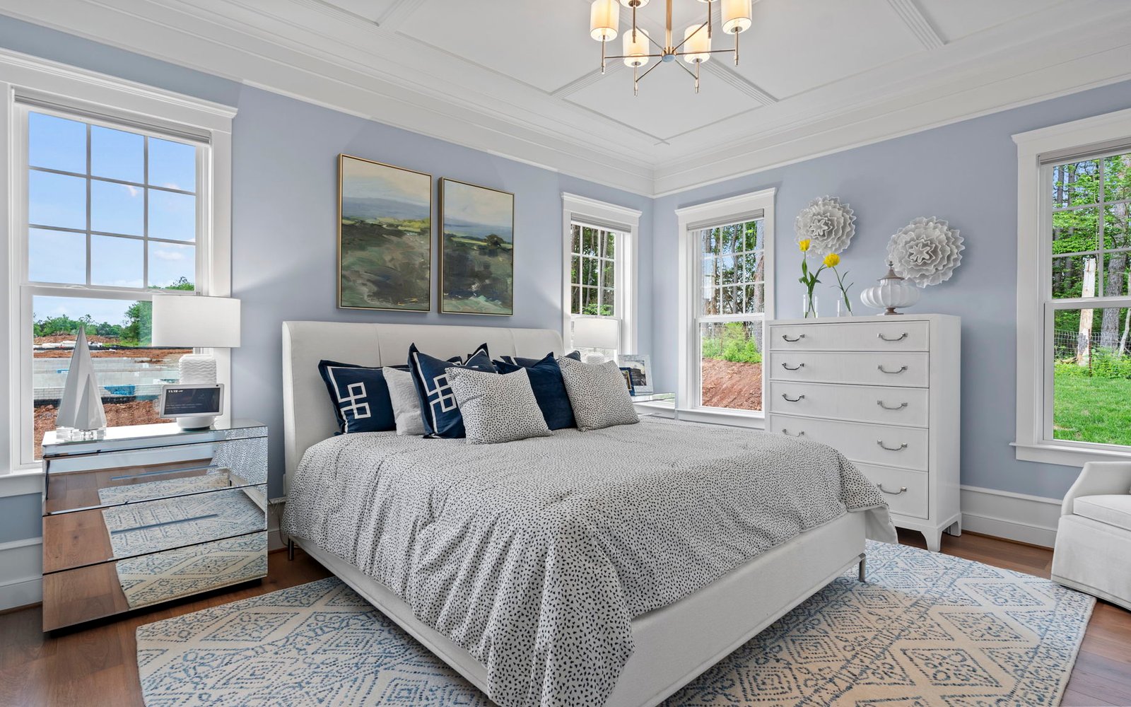 The main level primary bedroom of the Monet model at The Crest at Linton Hall. 