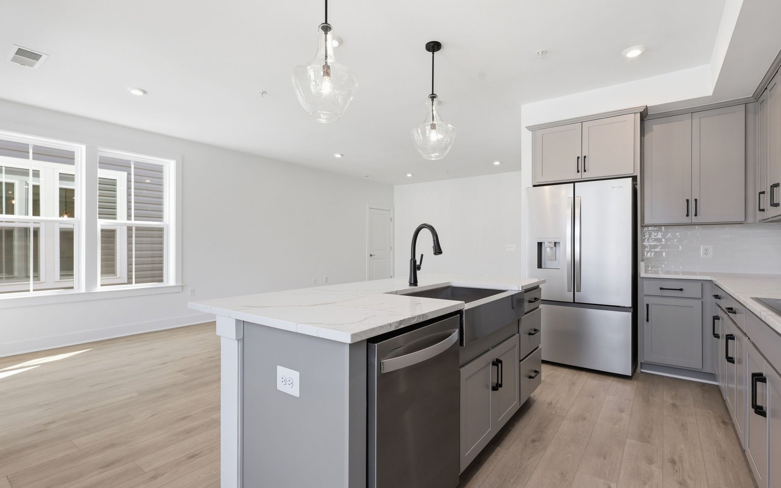 The kitchen layout showcasing the upgraded package 2 finishes in the Scarlet at Cascades at Embrey Mill.
