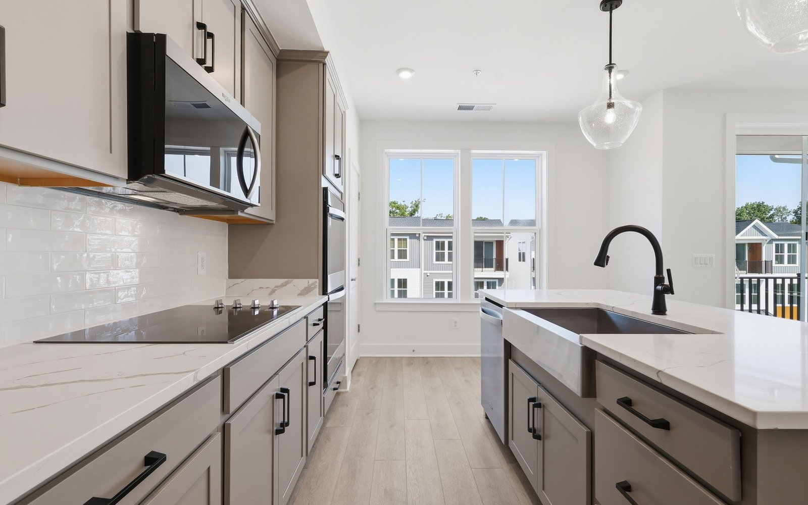The kitchen layout showcasing the upgraded package 2 finishes in the Scarlet at Cascades at Embrey Mill.