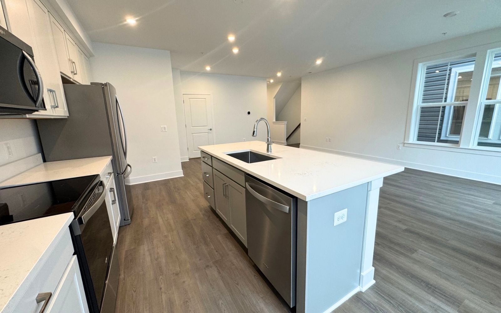 The kitchen and family room of the Amber on homesite 135 at Cascades at Embrey Mill.