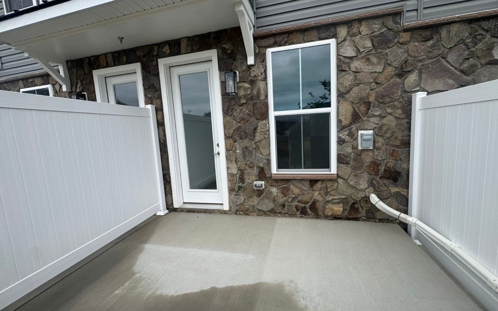 The rear patio of the Scarlet on homesite 1140 at Cascades at Embrey Mill.